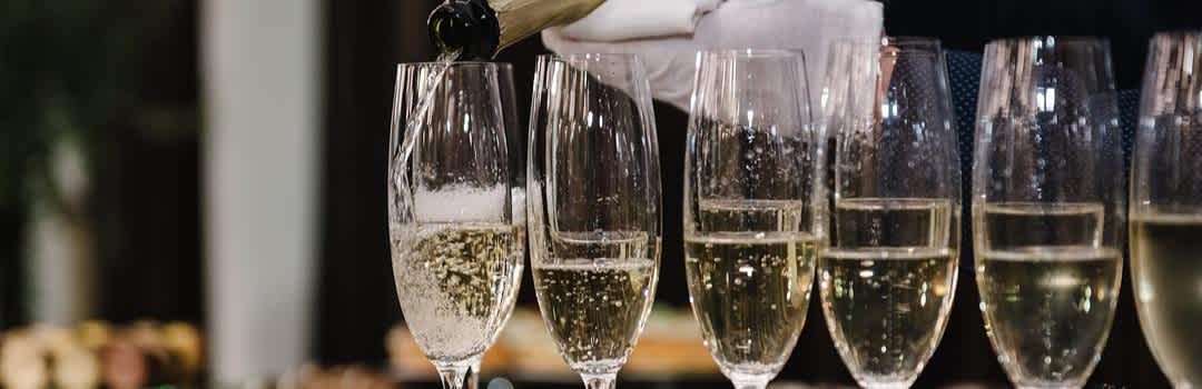 Wedding Champagne, Explained: Styles, Bottles, and What to Pour banner image