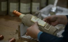 Vino de Eyzaguirre Hand-Wrapped and Labelled Wine Bottles Winery Image